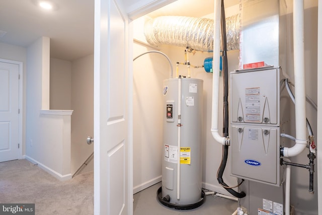 utility room with visible vents and electric water heater