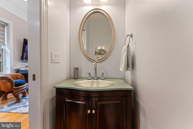 bathroom with vanity and wood finished floors