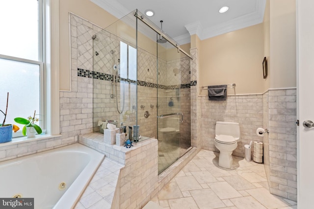 bathroom with toilet, a tub with jets, ornamental molding, and a shower stall