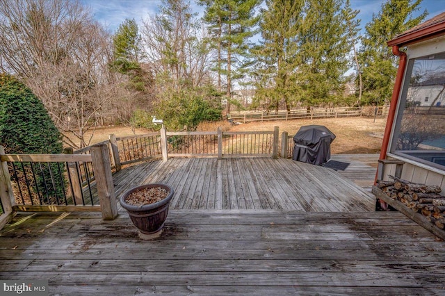 deck featuring a grill