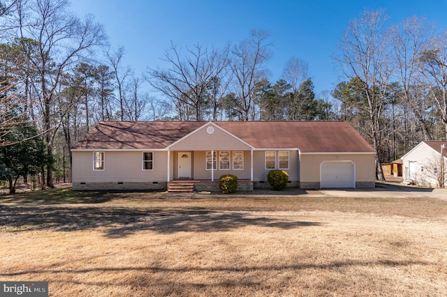 view of front of property featuring an attached garage, a front lawn, covered porch, crawl space, and driveway