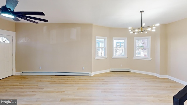 foyer entrance with ceiling fan with notable chandelier, light wood-type flooring, baseboards, and a baseboard radiator