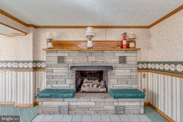 interior details featuring visible vents, a fire extinguisher, a fireplace, and crown molding