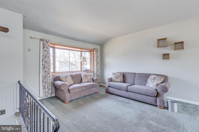 living room featuring carpet flooring and baseboards