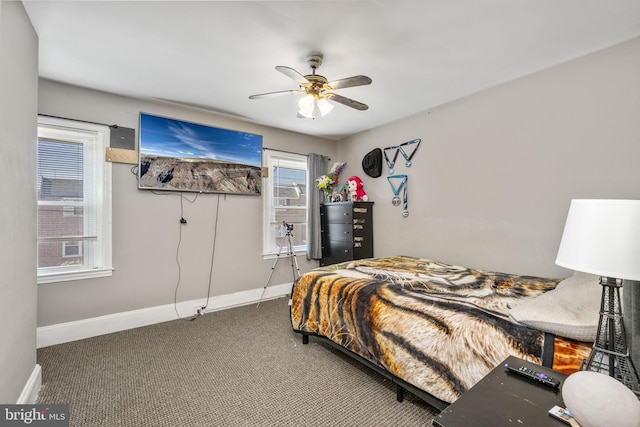 bedroom featuring a ceiling fan, baseboards, and carpet floors