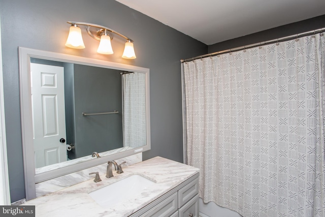 bathroom with vanity and shower / bath combo with shower curtain