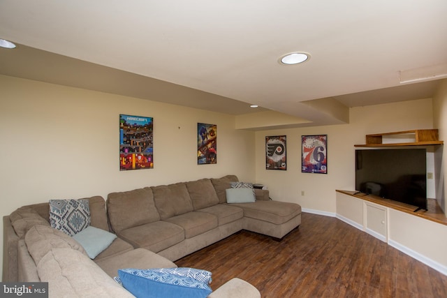 living area with recessed lighting, baseboards, and wood finished floors