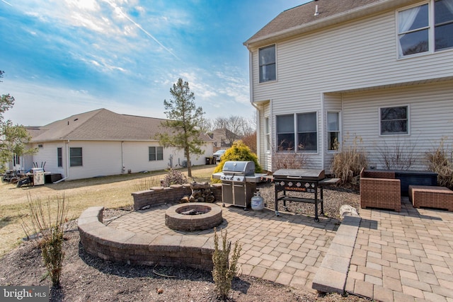 view of patio with grilling area and an outdoor fire pit