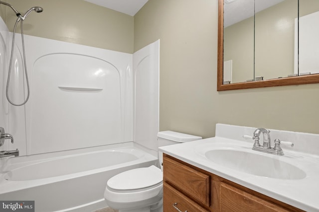 full bath featuring toilet, bathtub / shower combination, and vanity