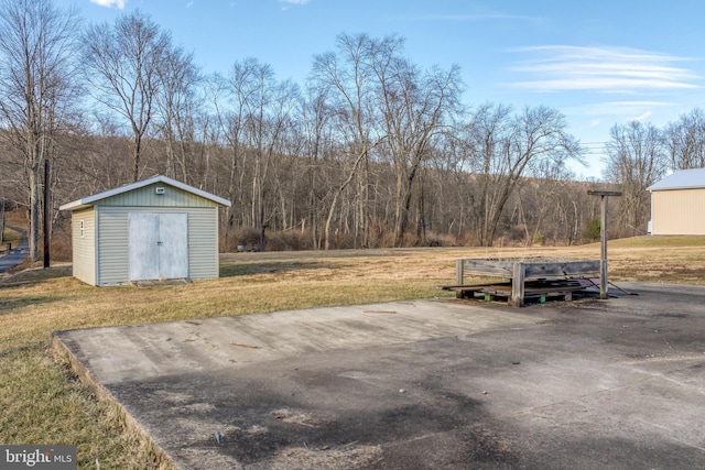 exterior space with a storage shed and an outdoor structure