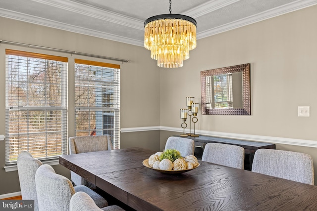 dining space with an inviting chandelier and crown molding