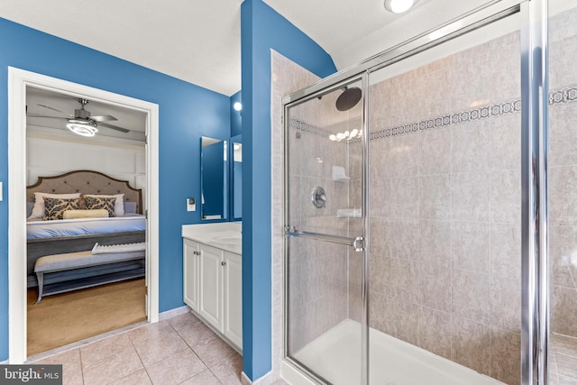bathroom featuring a shower stall, ensuite bathroom, tile patterned floors, vanity, and a ceiling fan