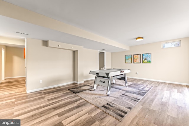 game room with visible vents, baseboards, and light wood-style flooring
