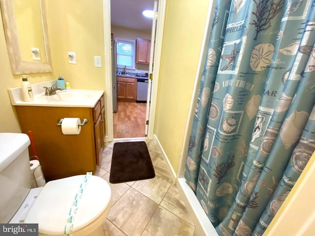 full bath with baseboards, toilet, a shower with shower curtain, tile patterned floors, and vanity