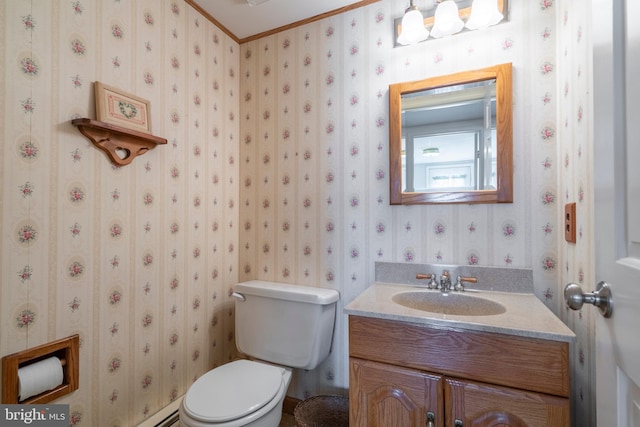 half bathroom featuring toilet, wallpapered walls, and vanity