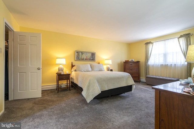 bedroom with dark colored carpet