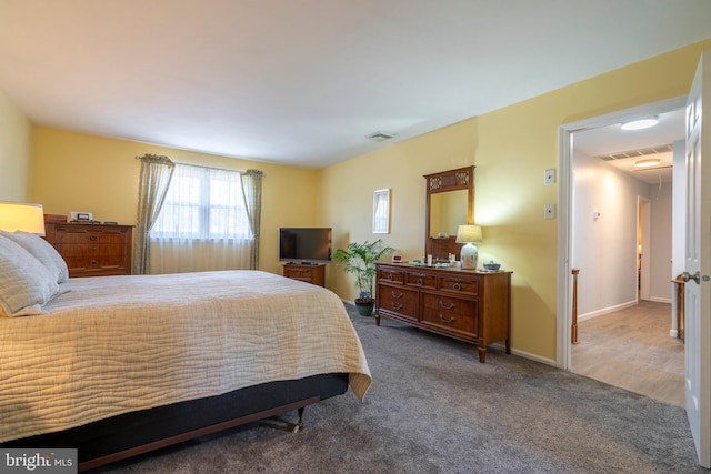 bedroom featuring carpet flooring, baseboards, and visible vents