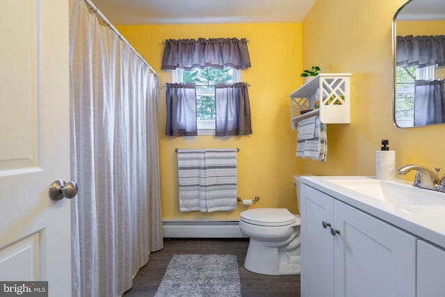 full bath with a baseboard heating unit, curtained shower, toilet, and vanity