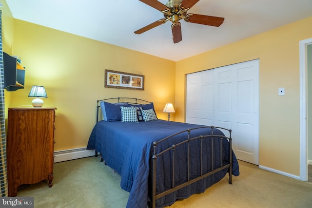 bedroom featuring a ceiling fan, baseboards, carpet, a baseboard radiator, and a closet