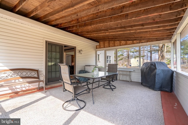 sunroom featuring wooden ceiling