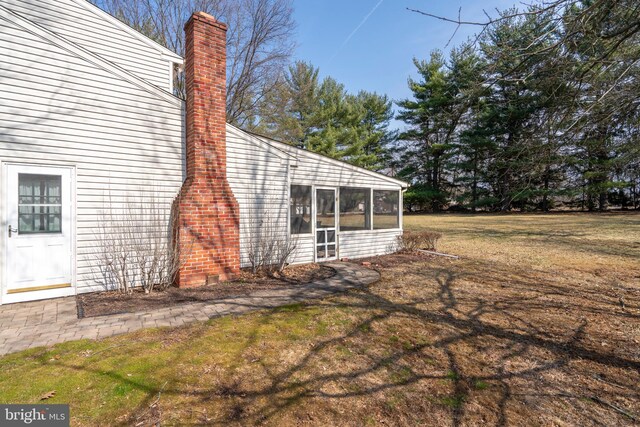 view of yard with a sunroom