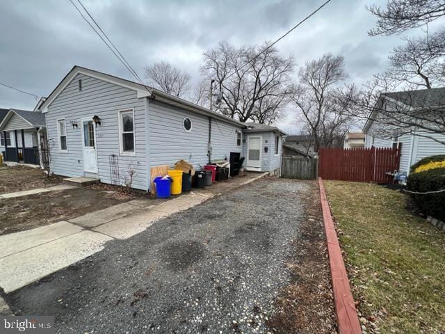 view of side of home with fence