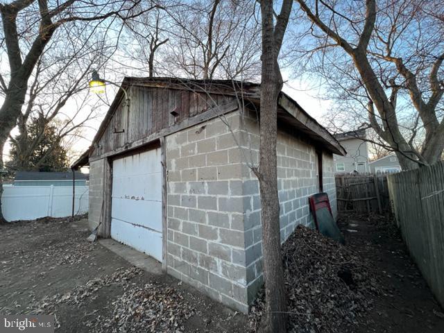 detached garage with fence