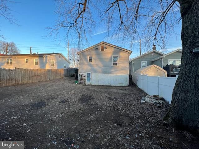 view of side of property with a fenced backyard