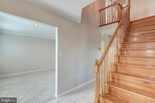 stairs featuring tile patterned floors, recessed lighting, carpet flooring, crown molding, and baseboards