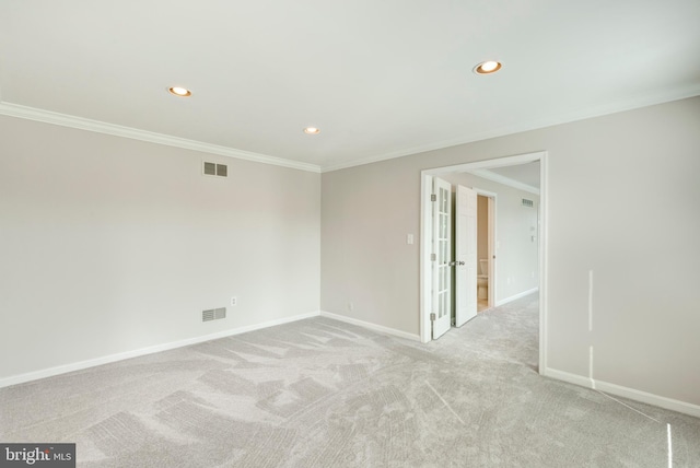 unfurnished room with recessed lighting, visible vents, baseboards, and crown molding