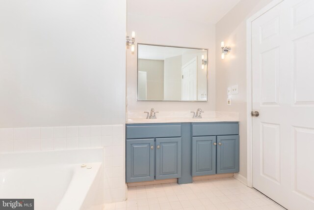 full bathroom with a sink, a bath, double vanity, and tile patterned flooring