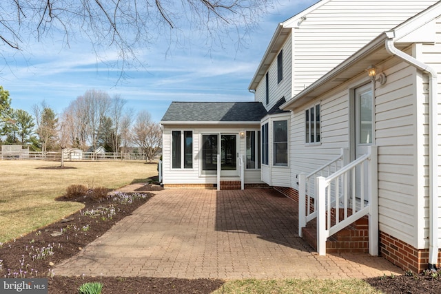 view of patio / terrace with fence and entry steps