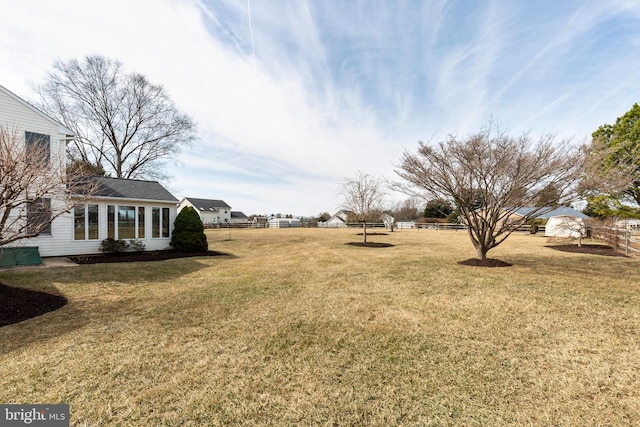 view of yard featuring fence