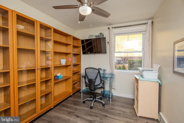 office with baseboards, dark wood-style flooring, and ceiling fan