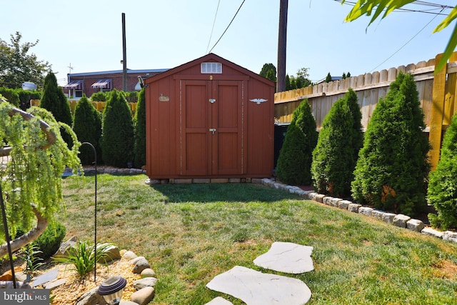 view of shed with fence