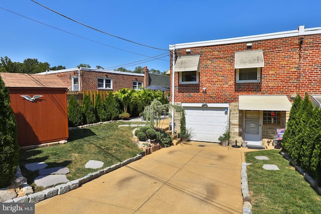 exterior space with a storage unit, brick siding, concrete driveway, and an attached garage