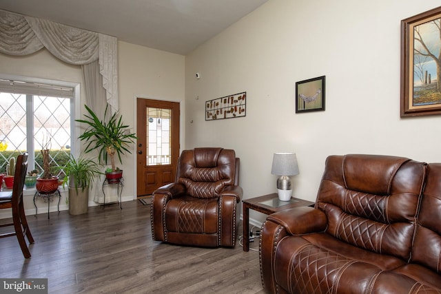 living area featuring wood finished floors and baseboards