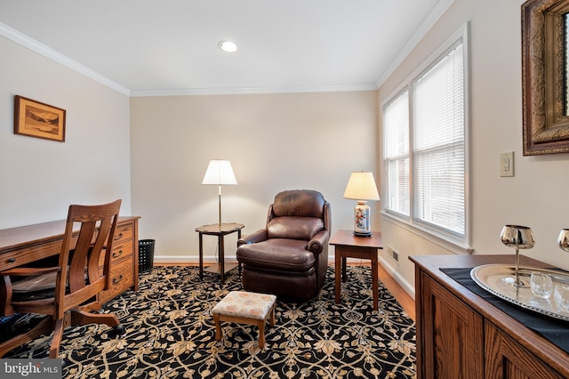 office area with visible vents, baseboards, and ornamental molding