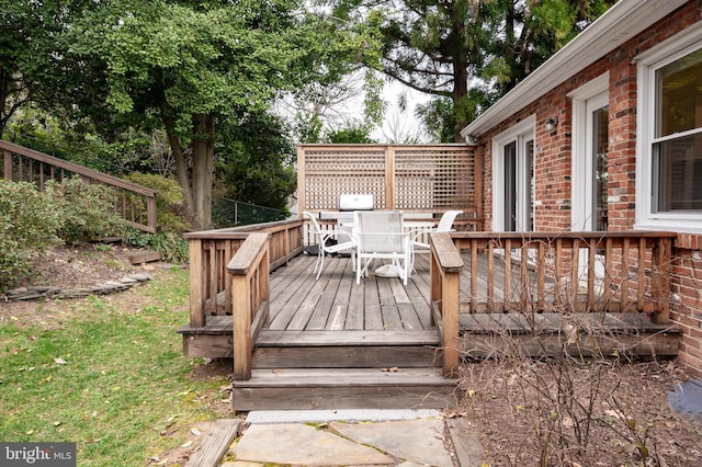 deck with outdoor dining space