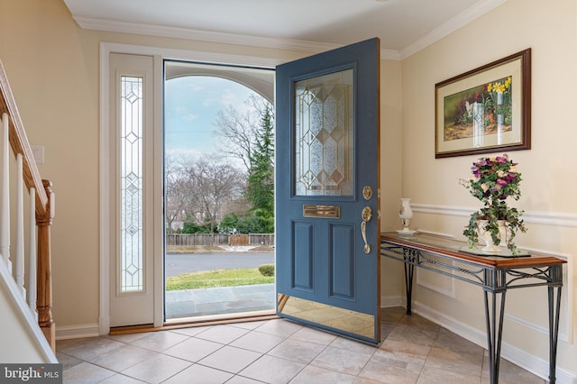 foyer entrance featuring crown molding, stairway, plenty of natural light, and light tile patterned floors