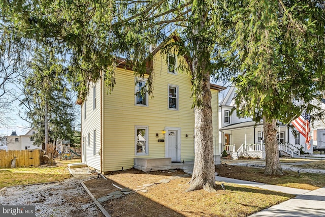 view of front of house with fence