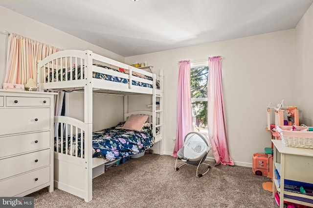 bedroom with carpet and baseboards