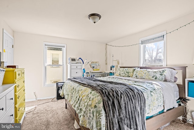 bedroom with baseboards and carpet floors