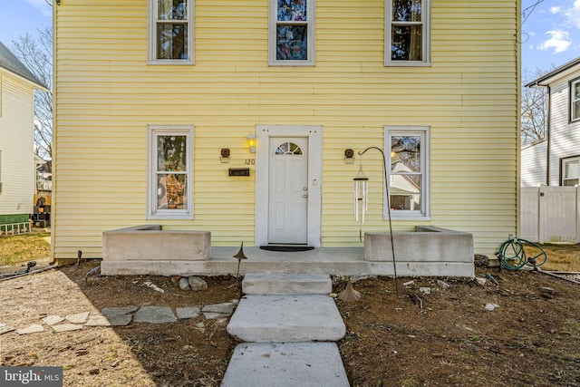 colonial inspired home featuring fence