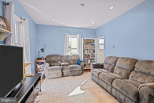 living room with recessed lighting and wood finished floors