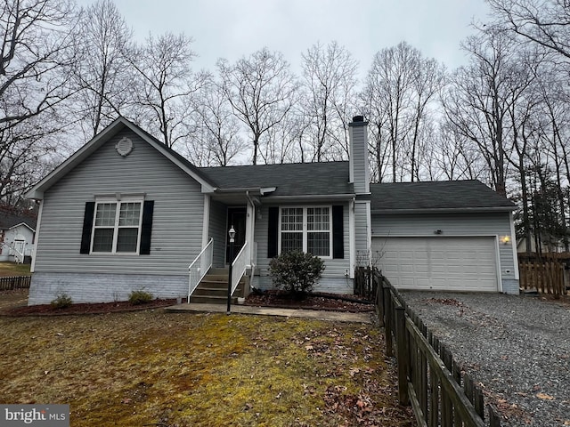 ranch-style home featuring a chimney, gravel driveway, an attached garage, and fence