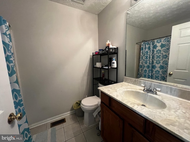 full bathroom featuring tile patterned floors, visible vents, toilet, a textured ceiling, and vanity