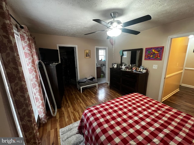 bedroom with a ceiling fan, wood finished floors, and a textured ceiling