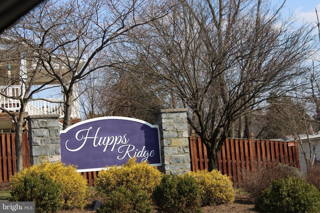 community sign with fence