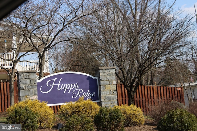 community sign with fence